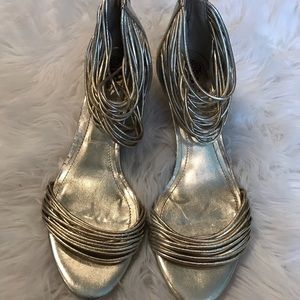 Gold strapped low heel shoe